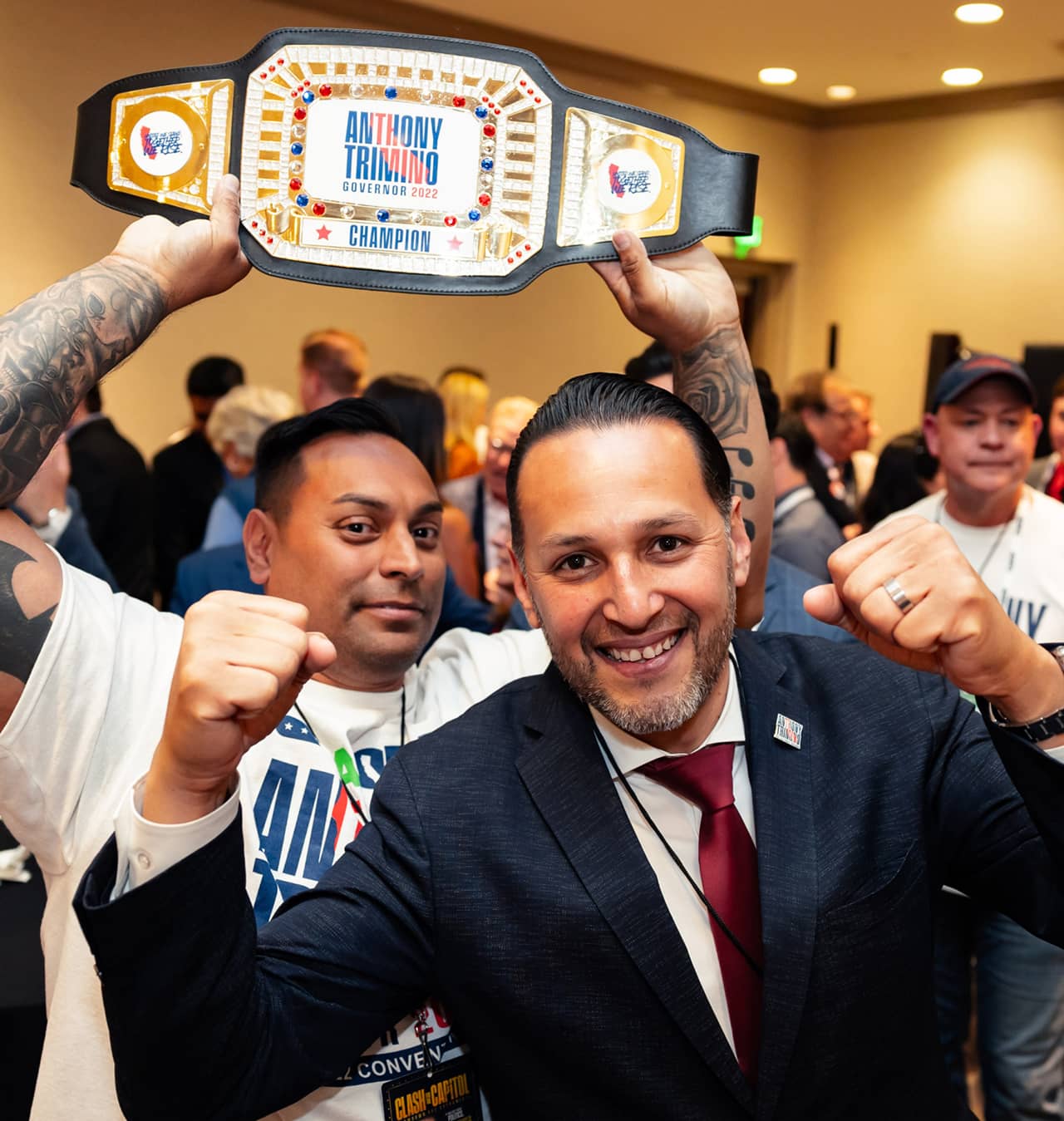 Anthony Trimino and supporter with title belt