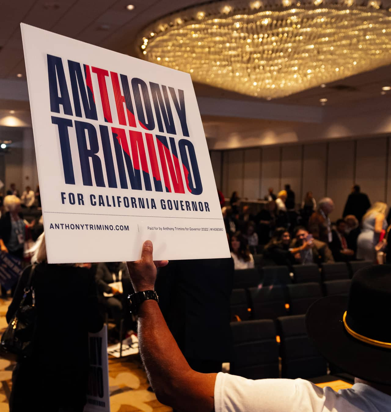 Supporter holding an Anthony Trimino sign