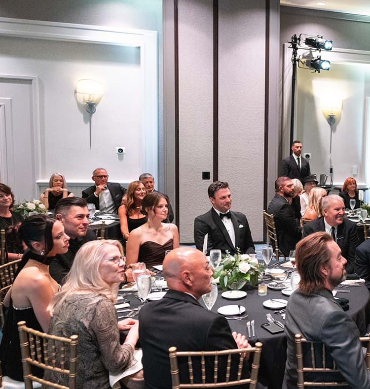 Crowd looking towards the stage at gala